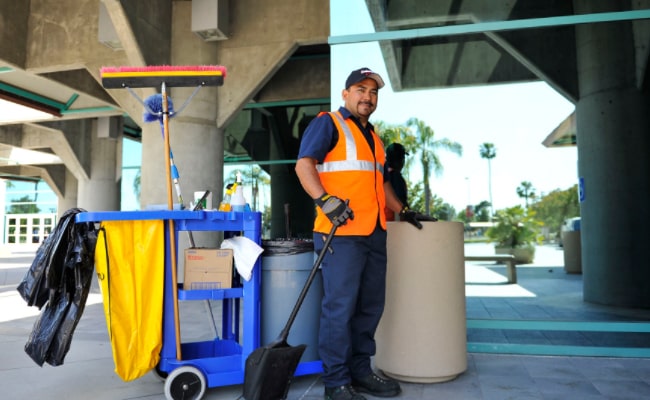 Photo of a cleaner with cleaning equipments